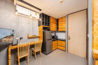 a kitchen with a counter and a refrigerator at Relife Rio 2 min to Nai Harn beach in Rawai Beach