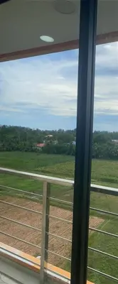 a view of a field from a train window at май кхао Студия в кондо 777 in Koh Lone