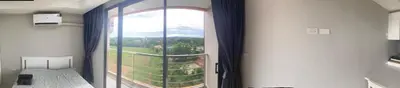 a room with a large window with a view at май кхао Студия в кондо 777 in Koh Lone