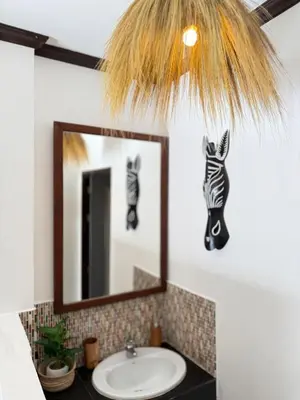 a bathroom with a sink and a mirror at Jungle style villa 3br in Kamala Beach