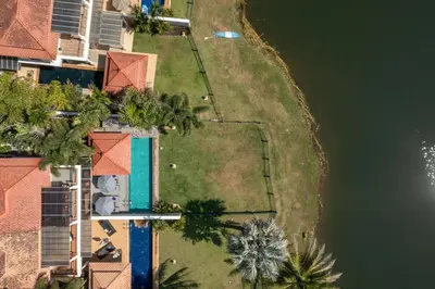 an overhead view of an island with houses and a body of water at Golden Cotton Villa 3BR Lagoon View by GRF in Laguna Phuket