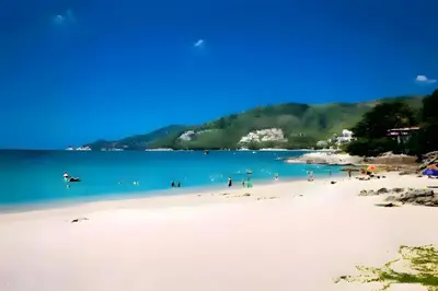 a view of a beach with people in the water at XX BAO Patong Beach Phuket - เบา ป่าตอง in Patong Beach