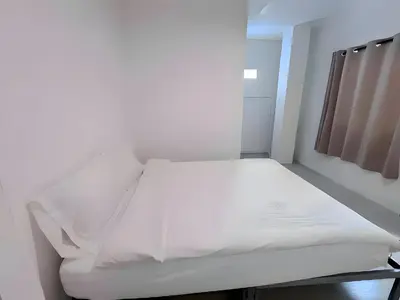 a white bed in a hospital room at XX BAO Patong Beach Phuket - เบา ป่าตอง in Patong Beach