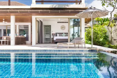 a swimming pool in front of a villa at Villa Sand in Pilai Beach