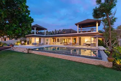 a house with a swimming pool in the backyard at Villa Sand in Pilai Beach