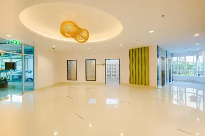 a lobby with a large white floor and a ceiling at W Phuket in Phuket Town