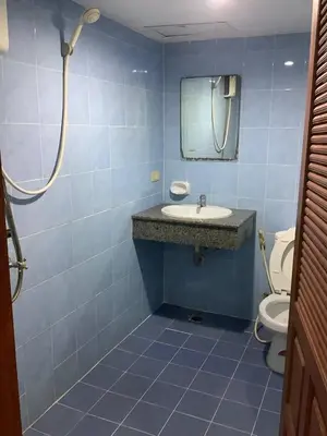 a bathroom with a sink and a mirror and a toilet at Freedom house in Karon Beach