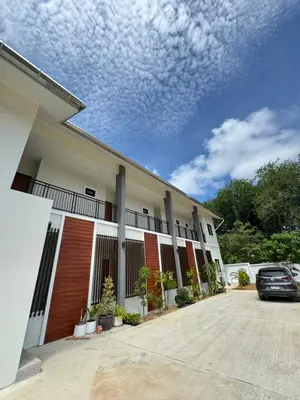 a car parked in front of a building at Lela Home in Phuket Town