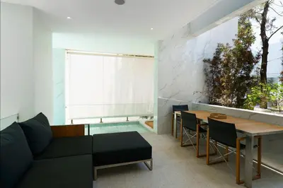 a living room with a couch and a table at Luxury Villa Residence near Laguna in Ban Pak Lak
