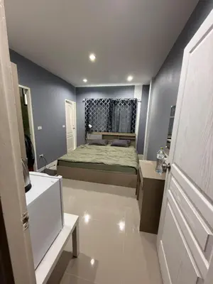 a small bedroom with a bed and a window at Come see comsa in Koh Lone