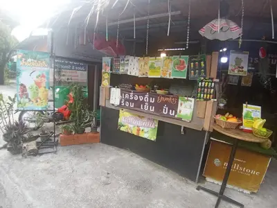 a fruit stand with a price sign on it at Come see comsa in Koh Lone