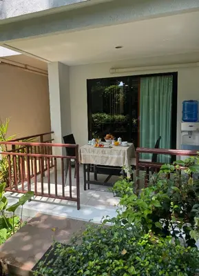 a patio with a table and chairs on a balcony at Rawai Title 3 in Rawai Beach