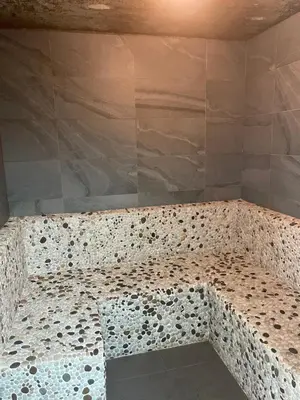 a shower with a stone bench in a room at Rawai Title 3 in Rawai Beach