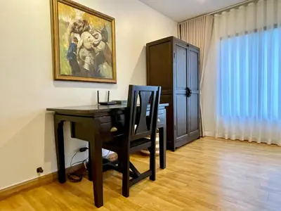 a room with a desk with a chair and a painting at Kata Sunset Bay Villa - 3BR Private Pool - Seaview in Kata Beach
