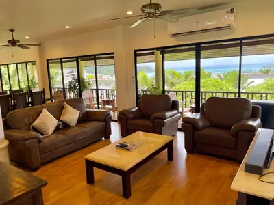 a living room with two couches and a coffee table at Kata Sunset Bay Villa - 3BR Private Pool - Seaview in Kata Beach