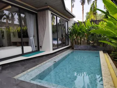 a swimming pool in front of a villa at Stylish 2BR Naiton Aileen Villa w Private Pool in Nai Thon Beach