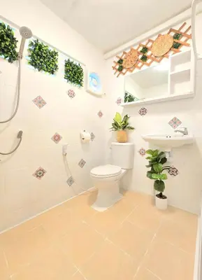 a bathroom with a toilet and a sink at Village Beach House II in Patong Beach