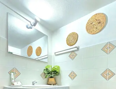a bathroom with a mirror and a sink at Village Beach House IV in Patong Beach