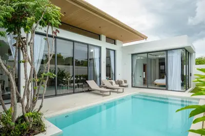 a swimming pool in a villa with a house at Mouana Residence Song Khun Chalong VIP4-bedroom Pool Villa 89-14 in Chalong