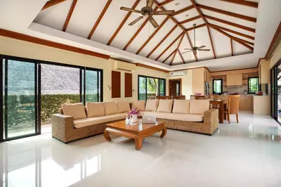 a living room with couches and a table at Balinese-Style 3Bedrooms Villa Tina in Kata Beach