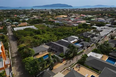 an aerial view of a city with houses and trees at Balinese-Style 3Bedrooms Villa Tina in Kata Beach