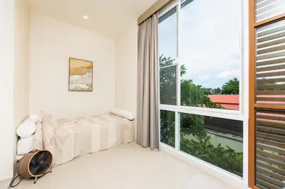a bedroom with a bed and a large window at Oxygen Villas with Private Pool Near Naiharn by TropicLook in Rawai Beach