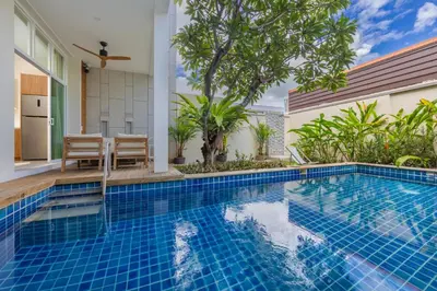 a swimming pool in a villa with a house at Oxygen Villas with Private Pool Near Naiharn by TropicLook in Rawai Beach