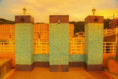 a building with three towers with blue tiles on it at Bellevue Ocean Patong in Patong Beach