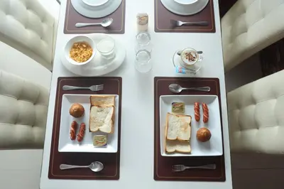 a table with two trays of food on it at Bellevue Ocean Patong in Patong Beach
