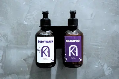 two bottles of body wash sitting on a table at Kuha Phuket Old Town in Phuket Town