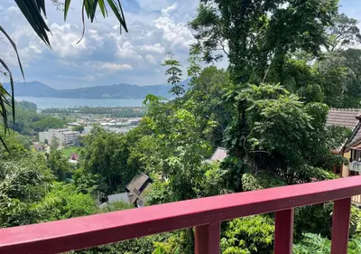 a red balcony with a view of the city and water at Amazing Seaview 2-Bedroom House in Patong in Patong Beach