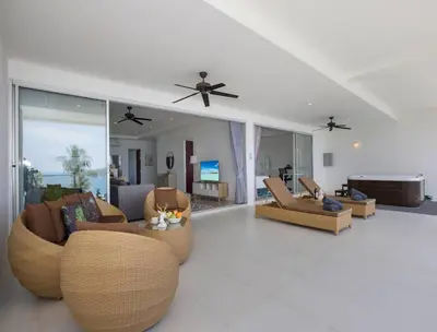 a large living room with couches and chairs at Oceanview Kata Penthouse - Pasifora in Kata Beach