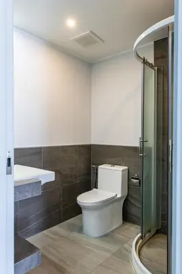 a bathroom with a toilet and a shower at Classic Studio Apt T3-329 in Chalong