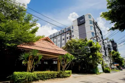 a building with a gazebo in front of a building at Sleek 2 Bed Apt T2-818 in Chalong