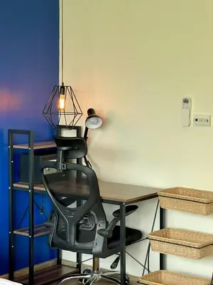 a desk with a chair and a lamp on it at veloche group 2 in Karon Beach