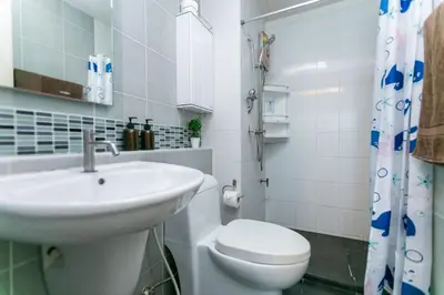 a white bathroom with a sink and a toilet at Tony DCondo in Kathu