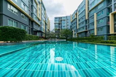 an empty swimming pool with buildings in the background at Tony DCondo in Kathu
