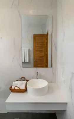 a white bathroom with a sink and a mirror at Dutch Villas Phuket in Koh Lone