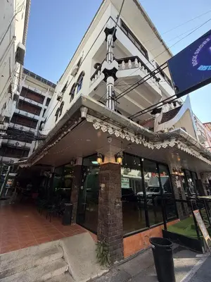 a building with a cross on the front of it at Beach Comber in Patong Beach