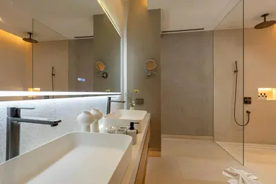 a bathroom with a tub and a sink and a shower at Layana Residence in Layan Beach