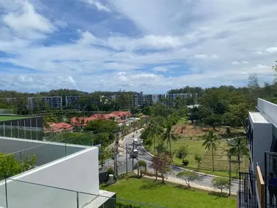 a view of a city from a building at Apartment at Skypark Laguna next to golf course in Bang Tao Beach