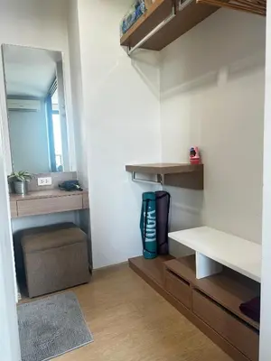 a room with shelves and a mirror on the wall at Top Floor Condo Mountainview, 5min to beach, Bangtao Phuket in Bang Tao Beach