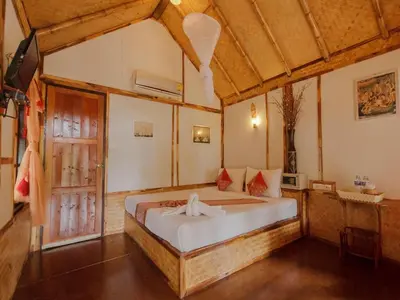 a bedroom with a bed in a room at Phuphaya Seaview Adults Only in Phi Phi Don
