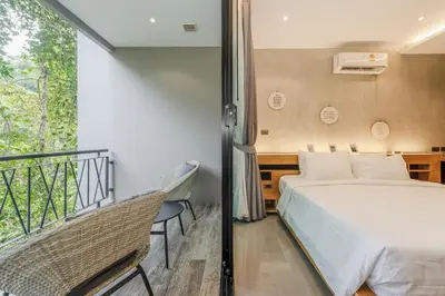 a bedroom with a bed and a balcony at C179 Serene and Stylish Getaway in Kamala, Phuket in Kamala Beach