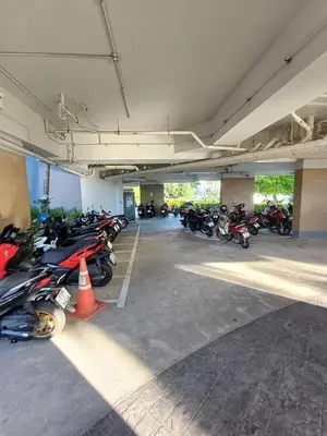 a group of motorcycles parked in a parking garage at Chic Condominium in Karon Beach