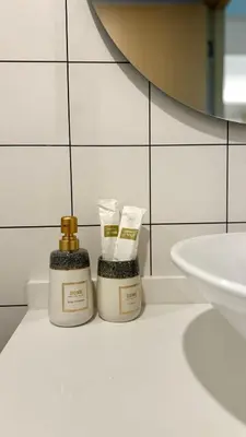 two bottles of soap sitting next to a sink at Fantasea Kamala Beach 1 BR 313 in Kamala Beach