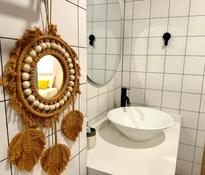 a bathroom with a mirror and a sink at Fantasea Kamala Beach 1 BR 313 in Kamala Beach