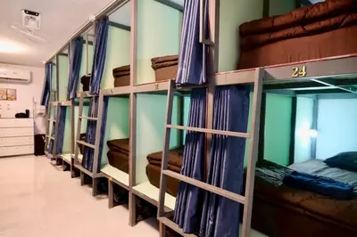 a row of bunk beds in a room at The City Hostel in Phi Phi Don