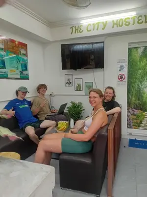 a group of people sitting in a waiting room at The City Hostel in Phi Phi Don