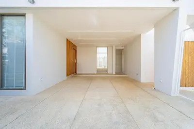 an empty living room with white walls and a large window at V183 Lux Pride Villas 3BR Private Pool Retreat in Bang Tao Beach
